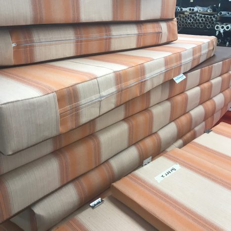 Pile of new upholstered cushions